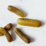 Fermented Foods - Cucumber Pickles on White Surface