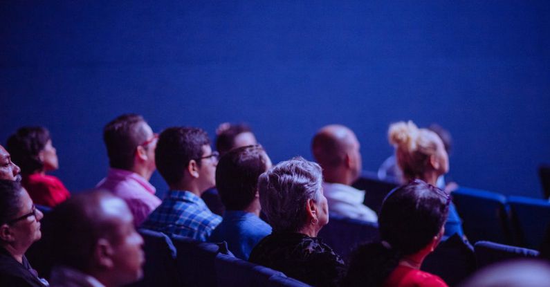 Conference - People Sitting on Gang Chairs
