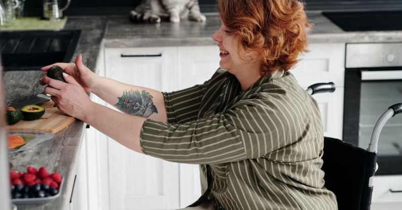 Cat Diet - Woman Sitting on Wheelchair While Holding Avocado