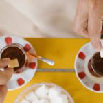 Teas - People Throwing Sugar Cubes to Teas