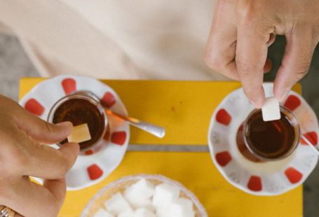 Teas - People Throwing Sugar Cubes to Teas