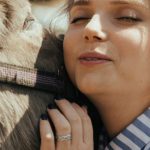 Pet - Woman in Blue and White Striped Long Sleeve Shirt Holding Black Horse