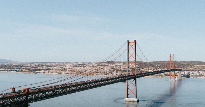 Travel Agents - Lisbon bridge similar to Golden Gate Bridge