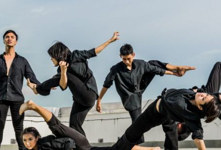 Flexibility - Persons in Black Shirt and Pants