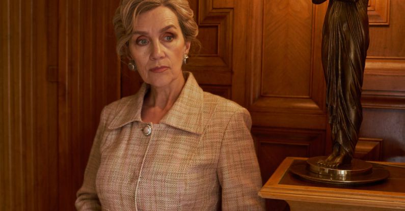 Living Spaces - Elegant Senior Woman Standing by Ornamental Retro Lamp