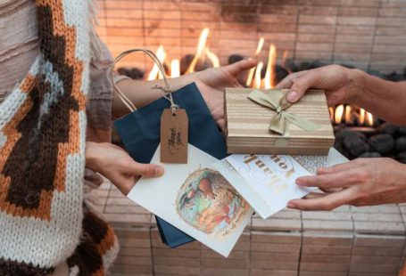 Family Reunion - Close-up Shot of People Exchanging Gifts and Cards