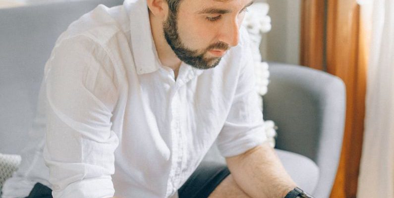Home Office - A Man Using a Laptop