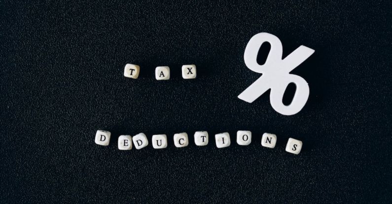 Tax Deductions - Tax Deductions Words on Black Surface