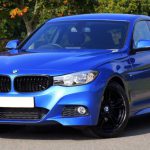 Car - Blue Bmw Sedan Near Green Lawn Grass