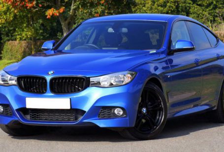 Car - Blue Bmw Sedan Near Green Lawn Grass